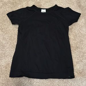 Athleta Girl brand, kids black shirt.
